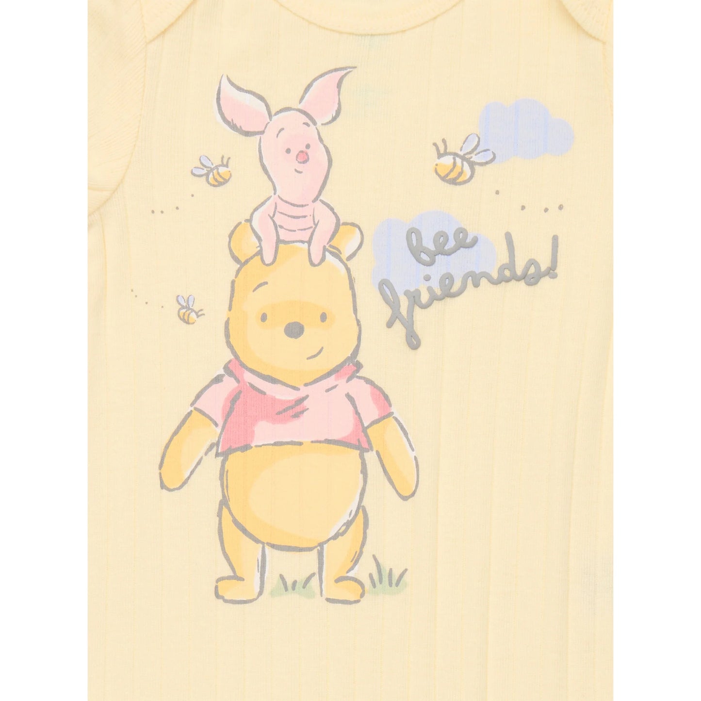 Baby romper with cartoon characters on a light yellow background