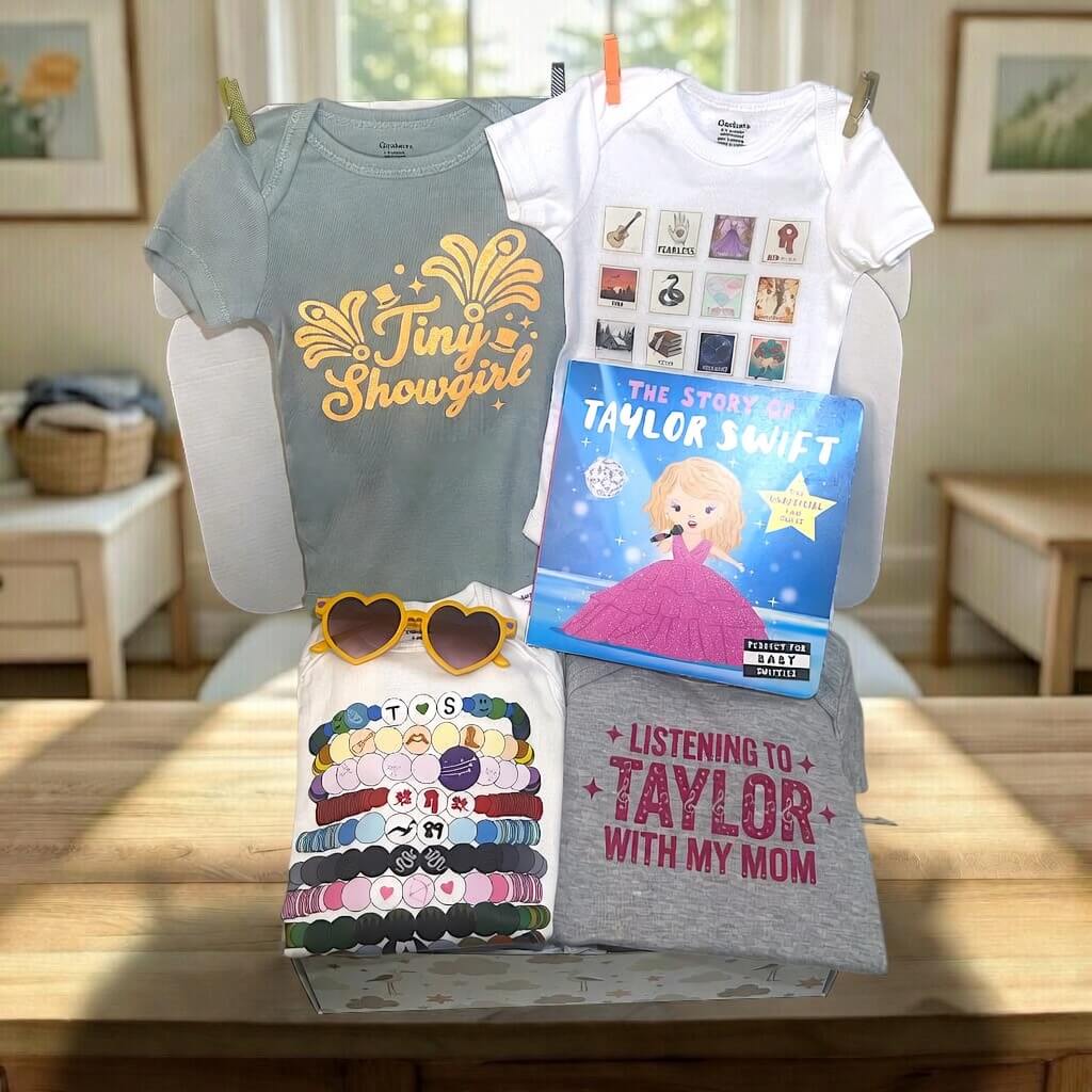 Collection of t-shirts and a book on a table with a home setting in the background