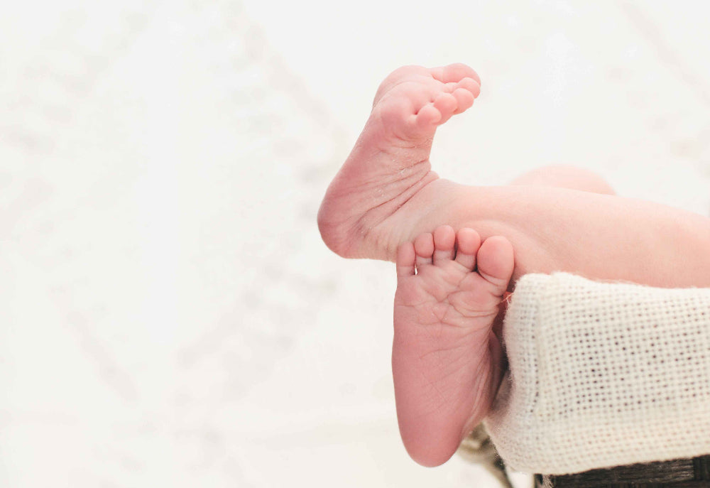 Close-up of a baby's feet with a white background