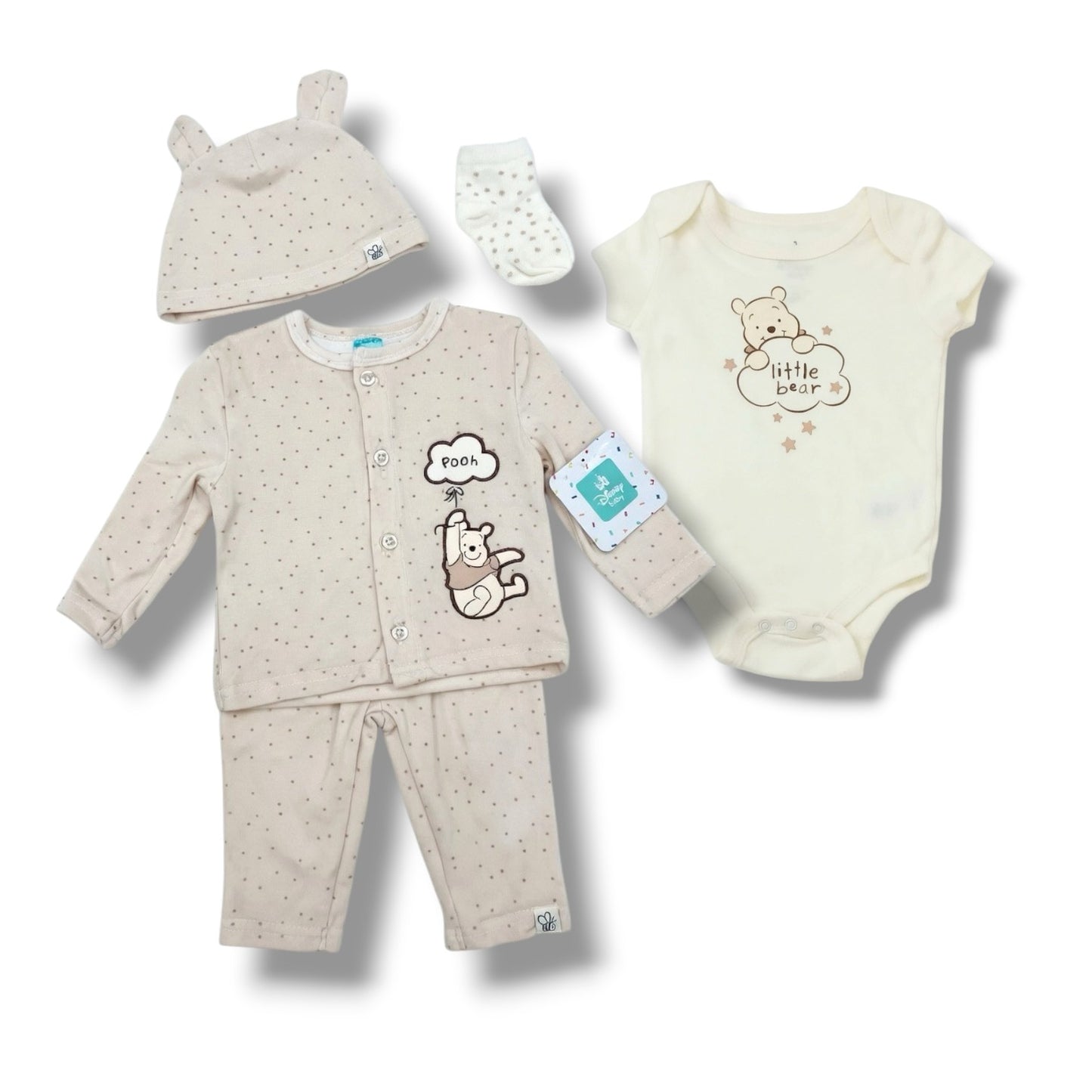 Baby clothing set with hat, romper, and pants on a white background
