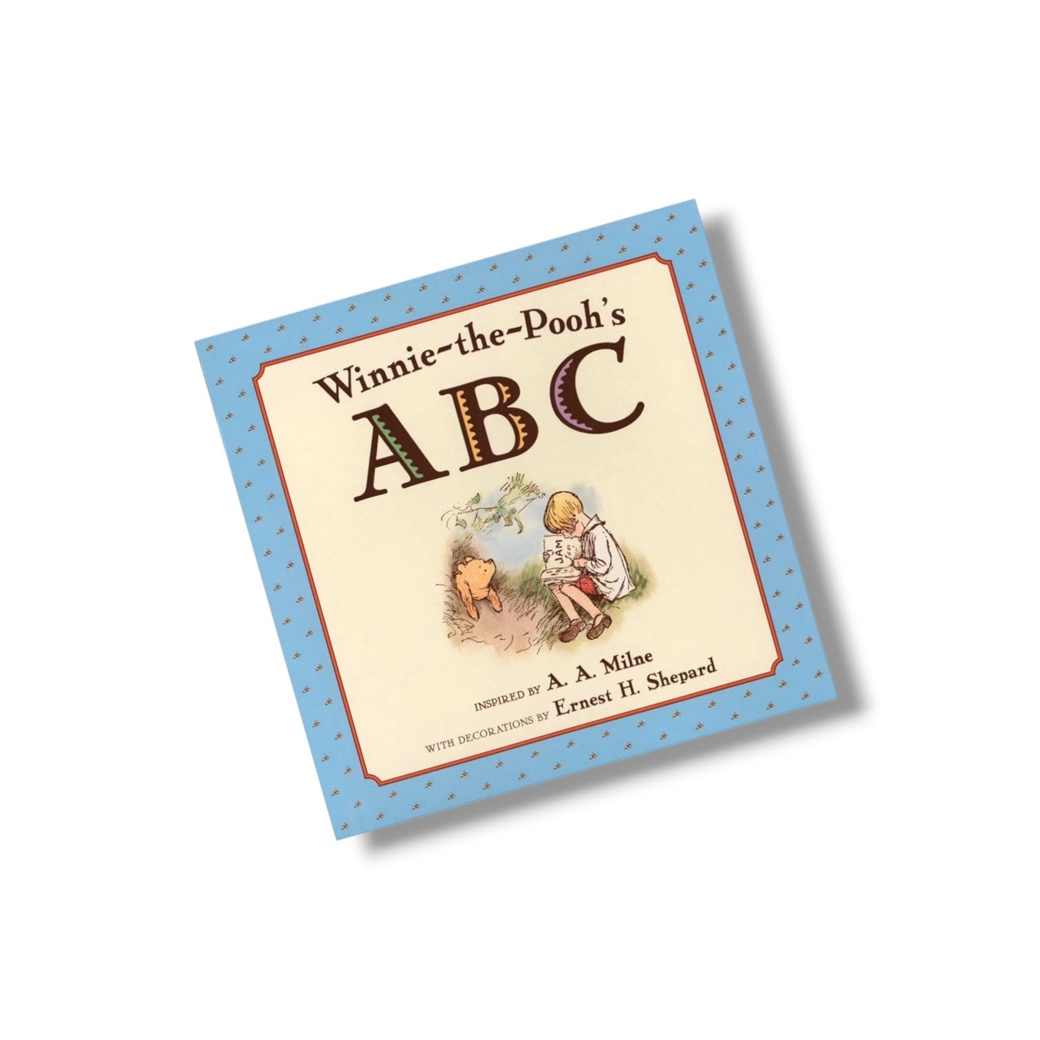 Book titled 'Winnie-the-Pooh's ABC' with illustrations on a white background