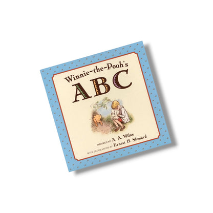 Book titled 'Winnie-the-Pooh's ABC' with illustrations on a white background